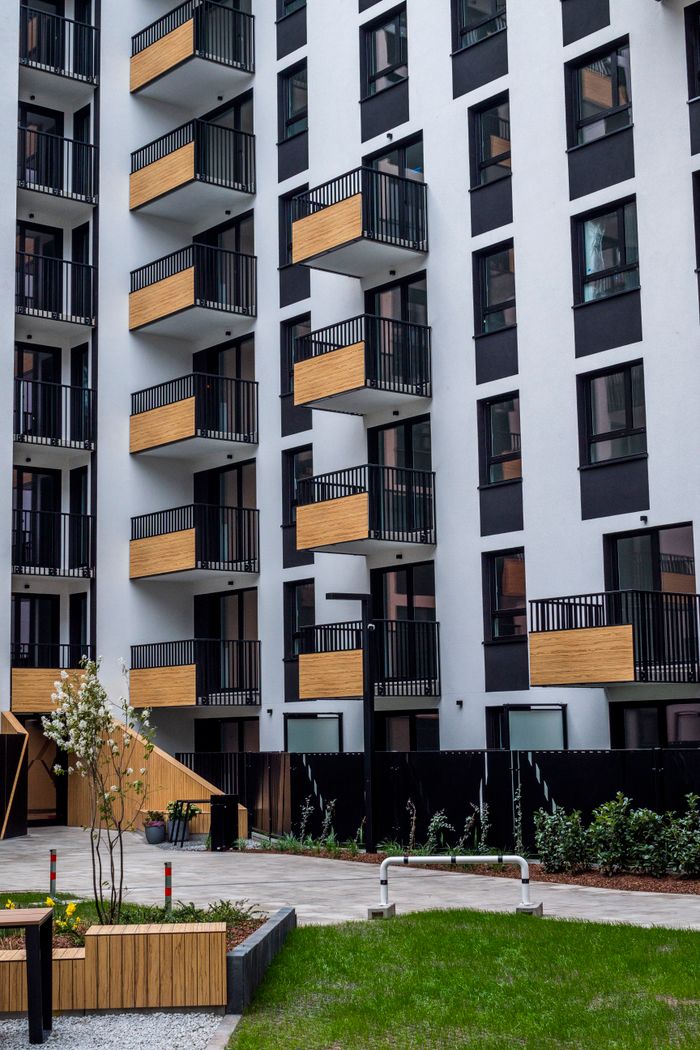 High-rise apartment building with balconies in a contemporary design.